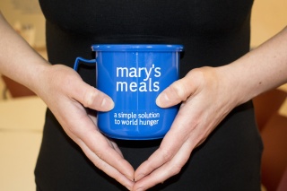 close-up of a blue Mary's Meals mug