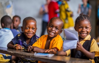 Children smiling in class in Liberia
