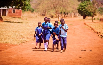 Children walk to school together.