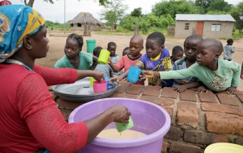 2025 - Zambia - children being served meals