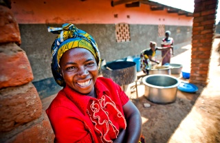 A volunteer cook in Zambia smiles