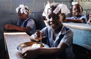 Children eating Mary's Meals in Haiti