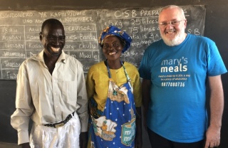 priest with volunteers