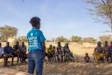 Mary's Meals working giving a speech to a small gathering