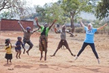 people performing star jumps outdoors