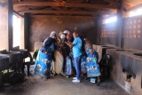 group of volunteers and staff huddling together in a classroom