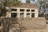 Building with bullet holes in Tigray