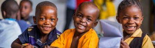 Children smiling in class in Liberia