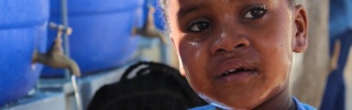 close up of a young girl with tears in her eyes