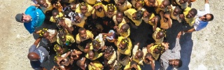 aerial shot of a group of people joined together in the shape of a love heart