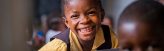 A Liberian child sitting in class gaining an education. 