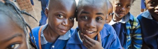 Boys joke and pose together in Zambia