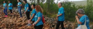 group of people cultivating land outdoors