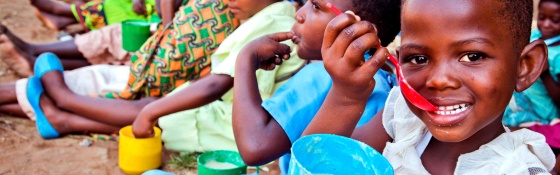 A child in Malawi enjoys food from Mary's Meals