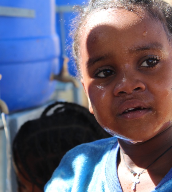close up of a young girl with tears in her eyes