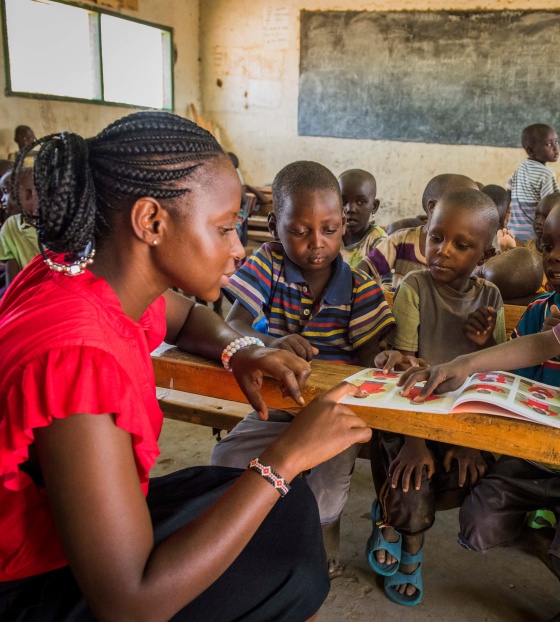 children in class listening attentively to their teacher 