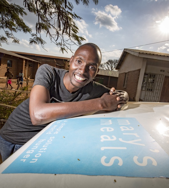 A school officer with his car in Malawi
