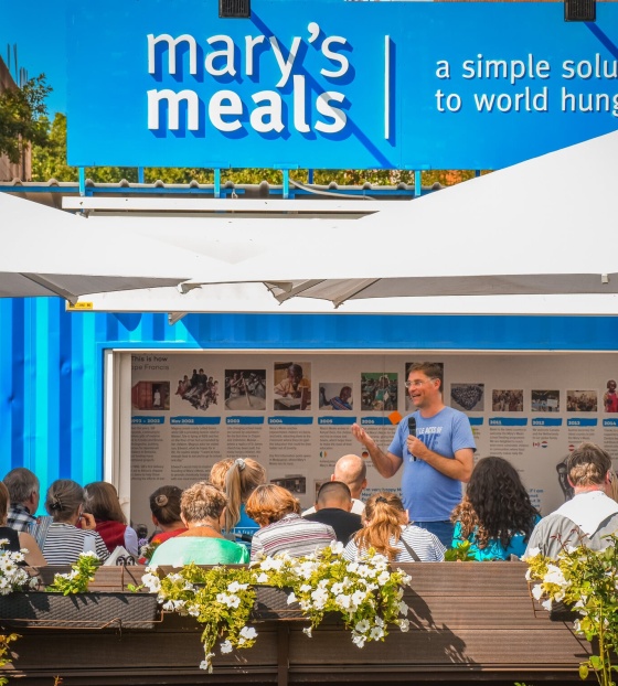 Mary's Meals founder, Magnus MacFarlane-Barrow speaking to supporters at the Mary's Meals information centre in Medjugorje