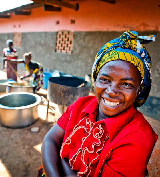 A volunteer cook in Zambia smiles