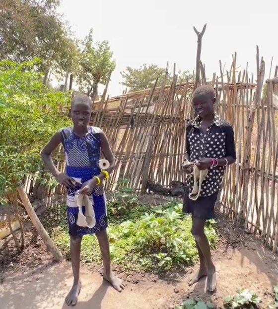 two girls outdoors posing for a photo