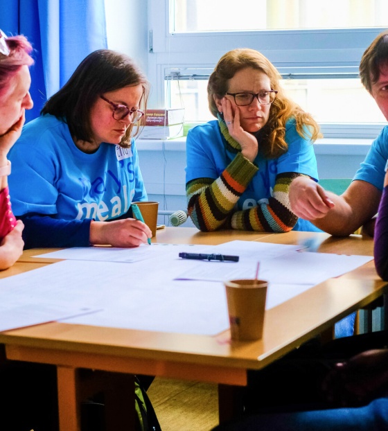 A group of Mary's Meals supporters gather to plan a fundraising event.