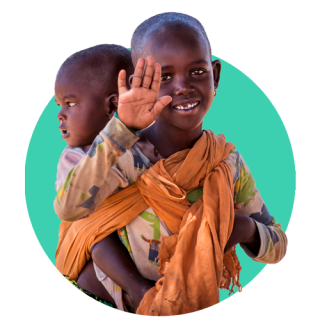 A child in Kenya waves as they carry a sibling