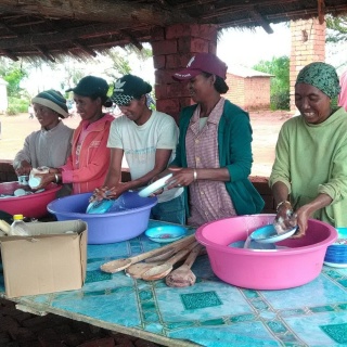 group of volunteers washing plates