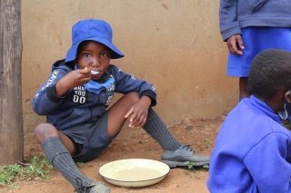 Learner enjoying Mary's Meals