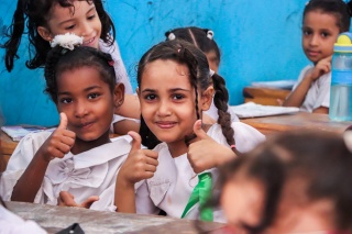 Children in Yemen enjoying school meals