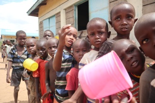 Children queue for school meals in Turkana