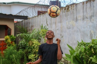 A boy plays football