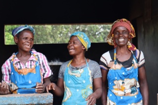 three women smiling and posing for a photo