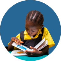 A young girl reads a book