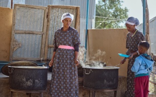 Volunteer cooks preparing meals.