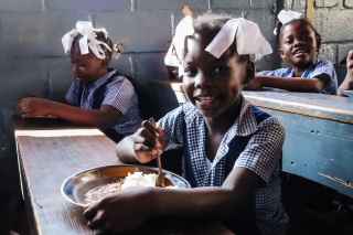 Children eating Mary's Meals in Haiti