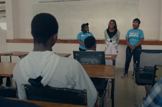 Lettie speaks with other young people in Malawi.